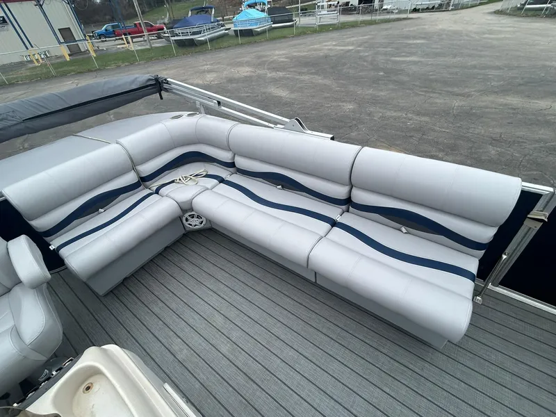 Slide: The Image of 1999 Sylvan 20 Cruise pontoon boat with spacious seating and modern design. - 7