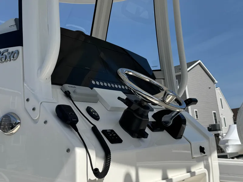 Slide: The Image of 2020 Regulator 26XO boat console with steering wheel and controls. - 15