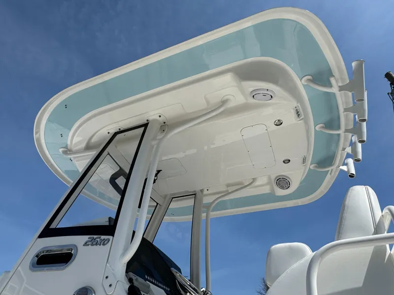 Slide: The Image of 2020 Regulator 26XO boat T-top against clear blue sky. - 16