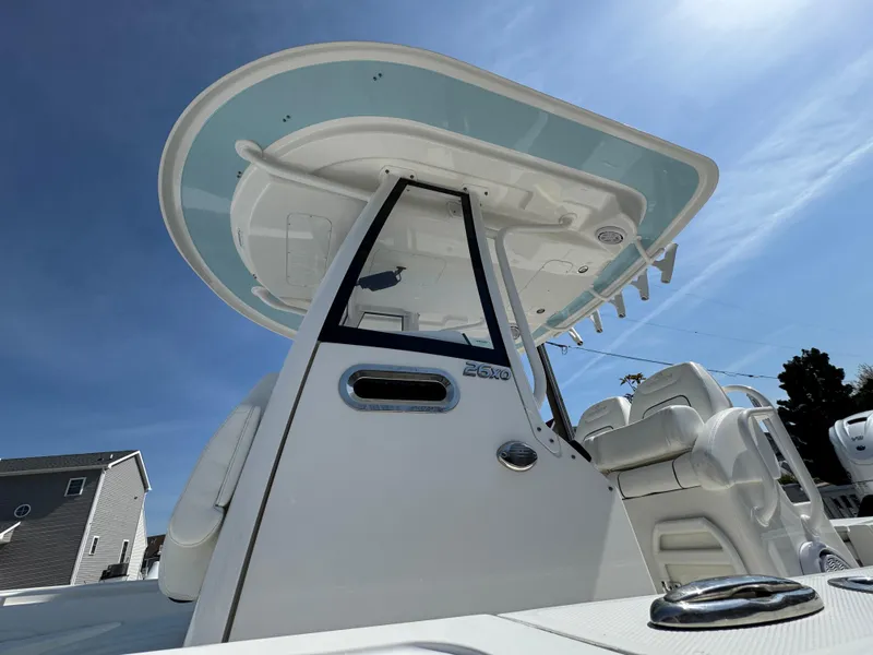 Slide: The Image of 2020 Regulator 26XO boat with sleek design and modern features under a clear blue sky. - 18