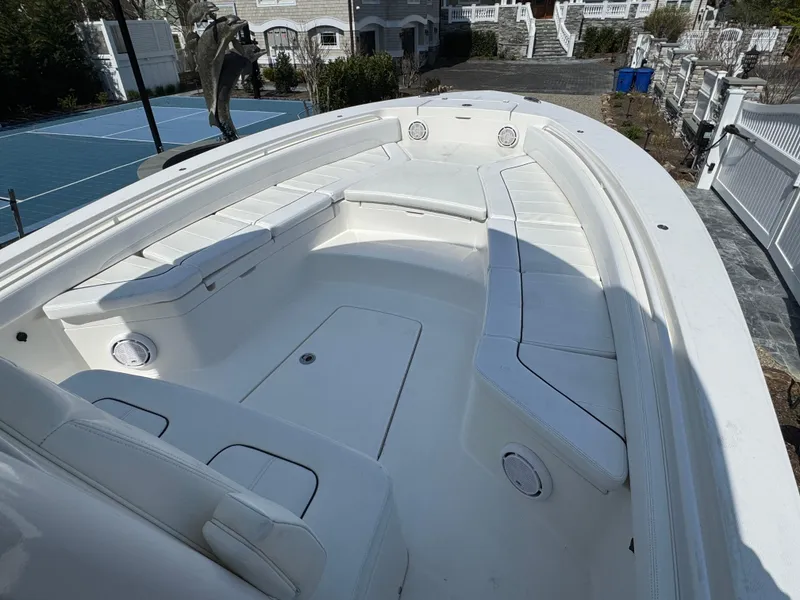 Slide: The Image of 2020 Regulator 26XO boat with spacious white seating and sleek design. - 19