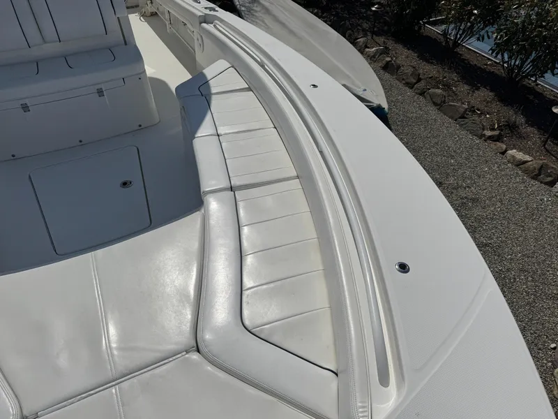 Slide: The Image of 2020 Regulator 26XO boat with white cushioned seating and sleek design. - 22