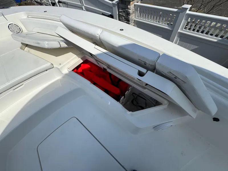 Slide: The Image of 2020 Regulator 26XO boat with open storage compartment, revealing red life jackets. - 30