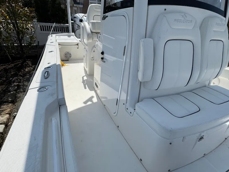 Slide: The Image of 2020 Regulator 26XO boat interior with white seating and console. - 36