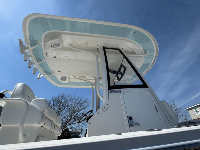 Slide: The Image of 2020 Regulator 26XO boat with T-top under clear blue sky. - 4