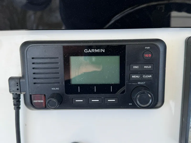 Slide: The Image of Garmin marine radio on 2020 Regulator 26XO boat dashboard. - 43