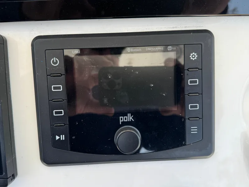Slide: The Image of Polk audio control panel on 2020 Regulator 26XO boat dashboard. - 45