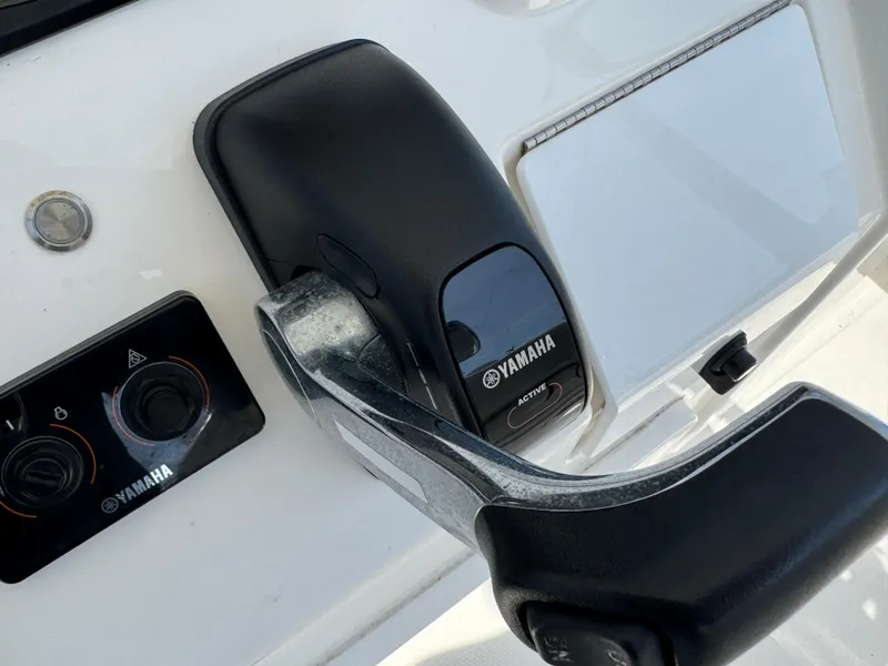 Slide: The Image of Yamaha controls on 2020 Regulator 26XO boat dashboard, featuring sleek design and functionality. - 46