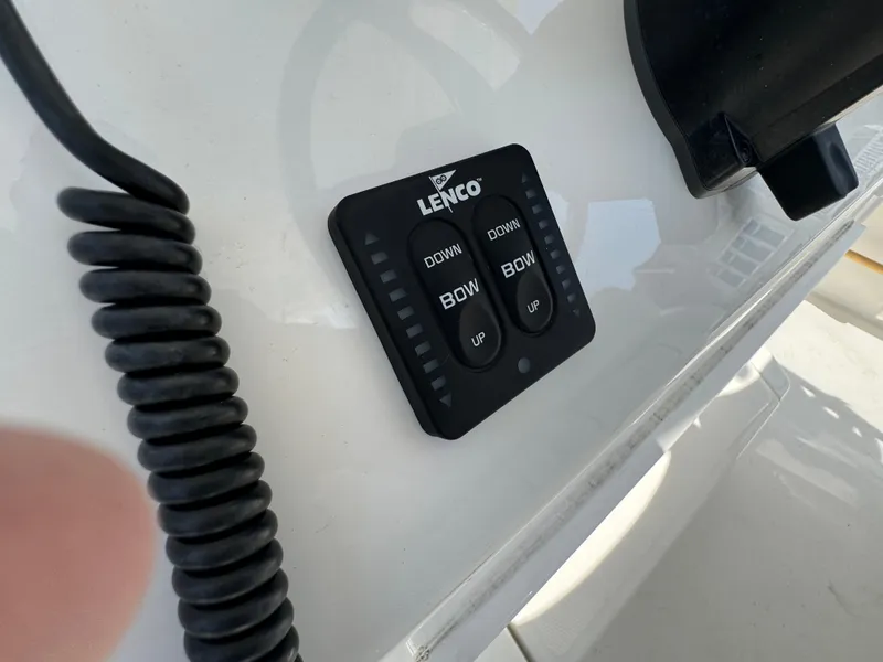 Slide: The Image of Lenco trim tab control panel on 2020 Regulator 26XO boat dashboard. - 49
