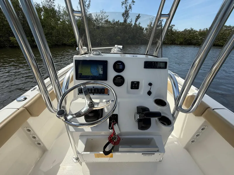 Slide: The Image of 2020 Key West 203 FS boat console with steering wheel and navigation system. - 10