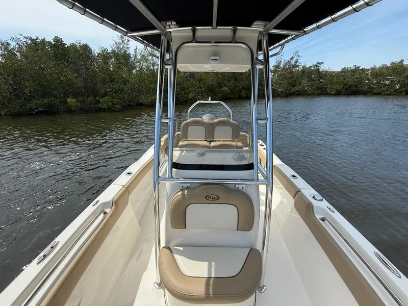 Slide: The Image of 2020 Key West 203 FS boat on calm water, featuring sleek design and comfortable seating. - 12