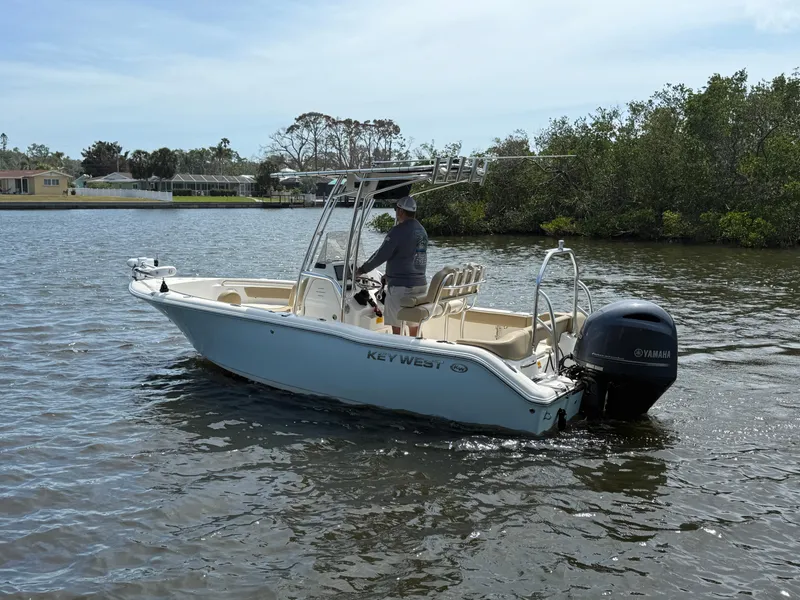 Slide: The Image of 2020 Key West 203 FS boat on calm water with Yamaha outboard motor. - 4