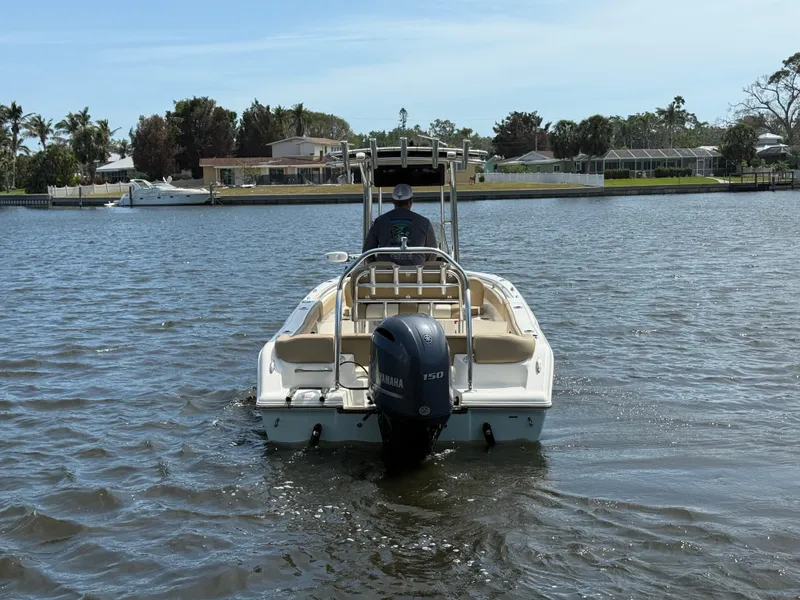 Slide: The Image of 2020 Key West 203 FS boat on calm water, featuring a Yamaha 150 engine. - 5