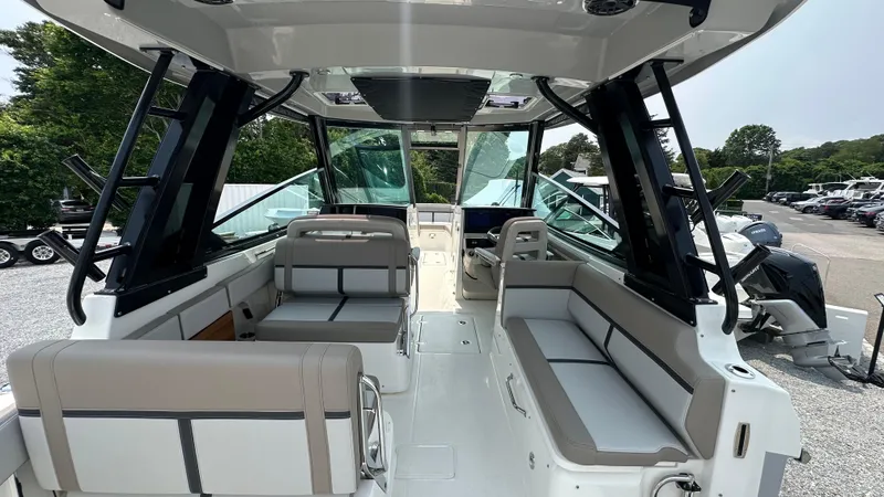 Slide: The Image of 2025 Boston Whaler 330 Vantage interior with spacious seating and modern design. - 11