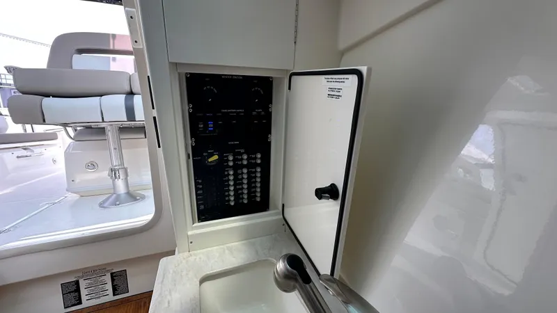 Slide: The Image of 2025 Boston Whaler 330 Vantage control panel and seating area. - 21