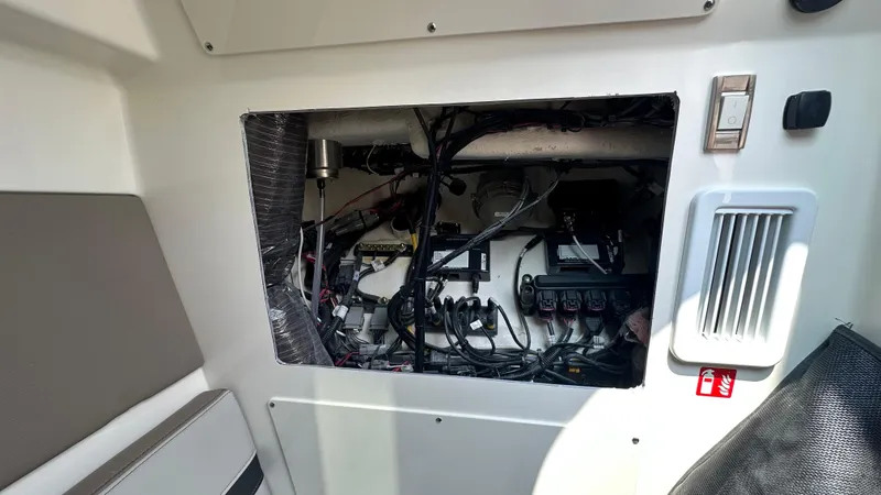 Slide: The Image of 2025 Boston Whaler 330 Vantage interior wiring and components view. - 23