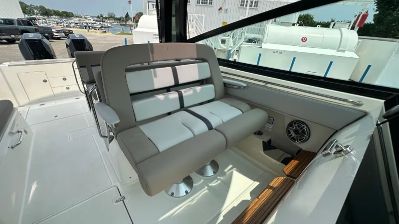 Slide: The Image of 2025 Boston Whaler 330 Vantage interior with plush seating and modern design. - 24