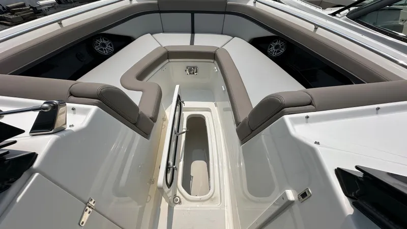 Slide: The Image of 2025 Boston Whaler 330 Vantage boat interior with spacious seating and storage compartment. - 34