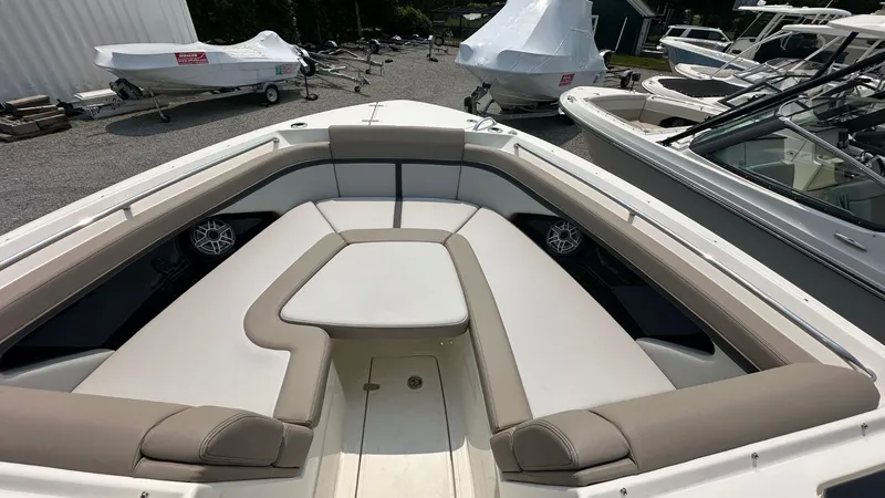 Slide: The Image of 2025 Boston Whaler 330 Vantage boat interior with cushioned seating and modern design. - 37