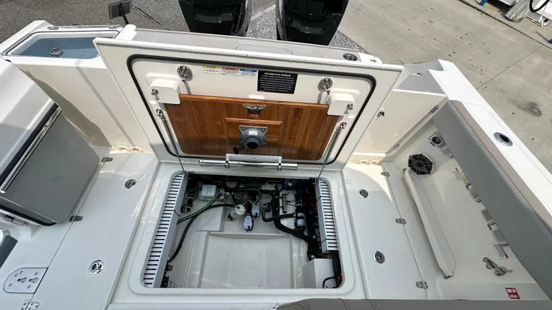 Slide: The Image of 2025 Boston Whaler 330 Vantage engine compartment, showcasing modern design and functionality. - 7