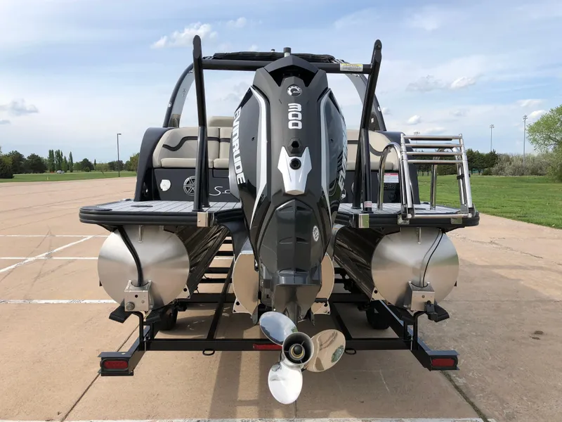 Slide: The Image of 2018 South Bay 25 Sport CR9 pontoon boat with Evinrude 200 engine, parked on trailer. - 11