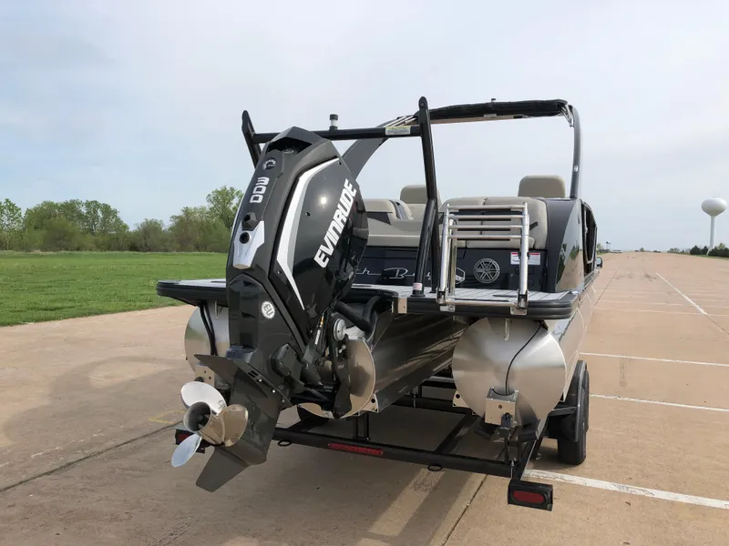 Slide: The Image of 2018 South Bay 25 Sport CR9 pontoon boat with Evinrude outboard motor on trailer. - 12