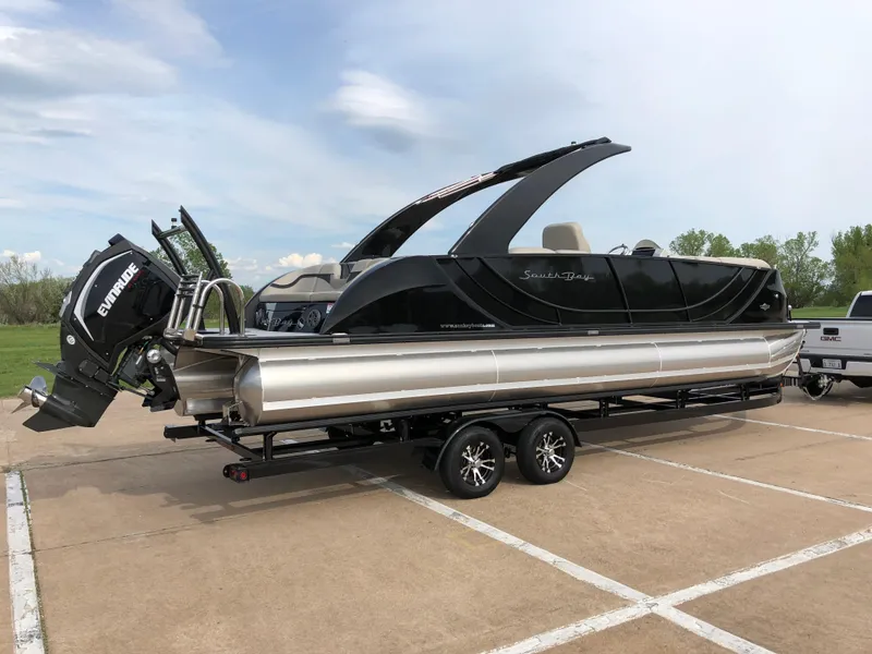 Slide: The Image of 2018 South Bay 25 Sport CR9 pontoon boat on trailer, featuring sleek black design. - 15