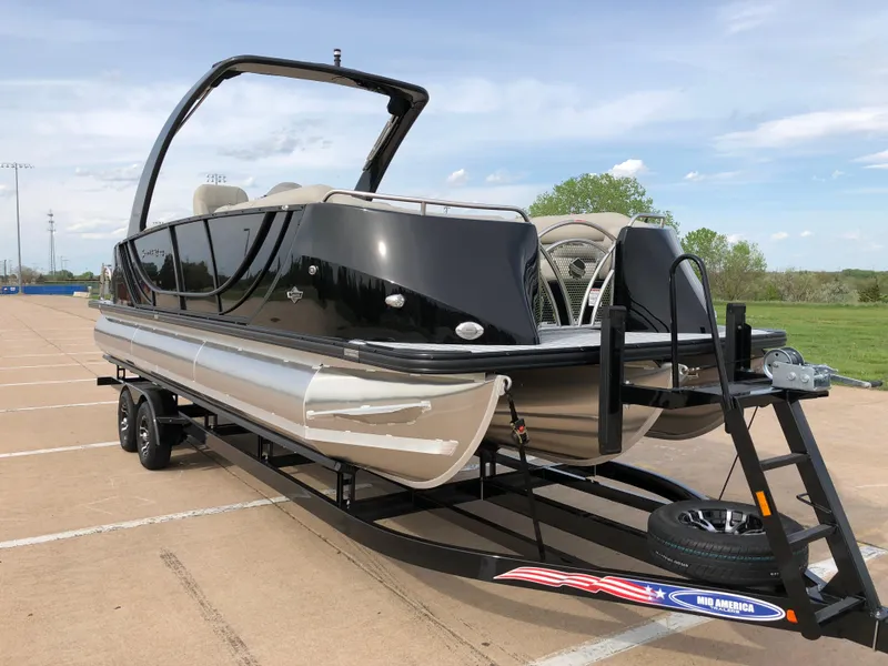 Slide: The Image of 2018 South Bay 25 Sport CR9 pontoon boat on trailer in parking lot. - 19