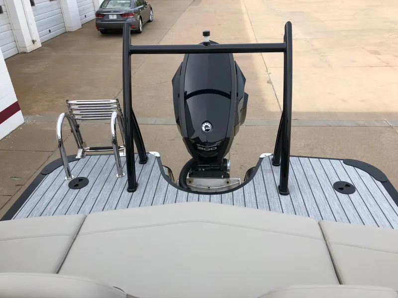 Slide: The Image of 2018 South Bay 25 Sport CR9 boat with outboard motor and swim ladder on deck. - 28