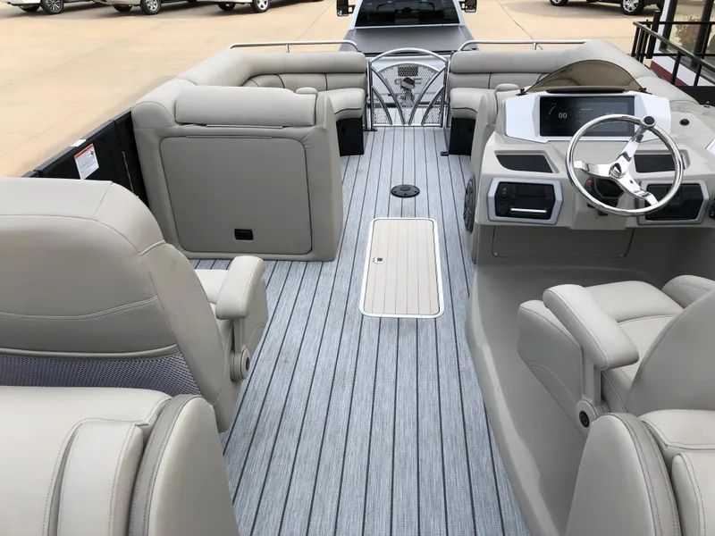 Slide: The Image of 2018 South Bay 25 Sport CR9 boat interior with plush seating and modern steering console. - 31