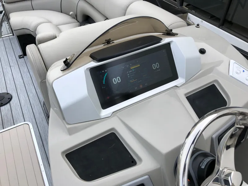 Slide: The Image of 2018 South Bay 25 Sport CR9 boat dashboard with modern controls and steering wheel. - 33