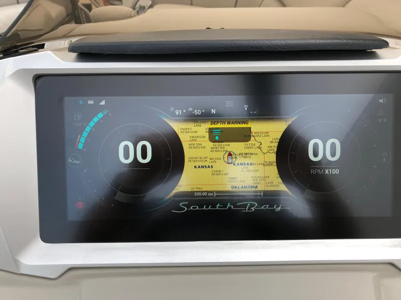 Slide: The Image of Dashboard display of a 2018 South Bay 25 Sport CR9 boat, showing navigation and RPM gauges. - 34