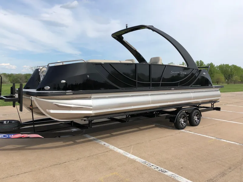 Slide: The Image of 2018 South Bay 25 Sport CR9 pontoon boat on trailer in parking lot. - 4