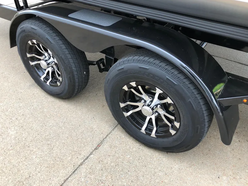 Slide: The Image of 2018 South Bay 25 Sport CR9 trailer with dual black alloy wheels on concrete. - 41