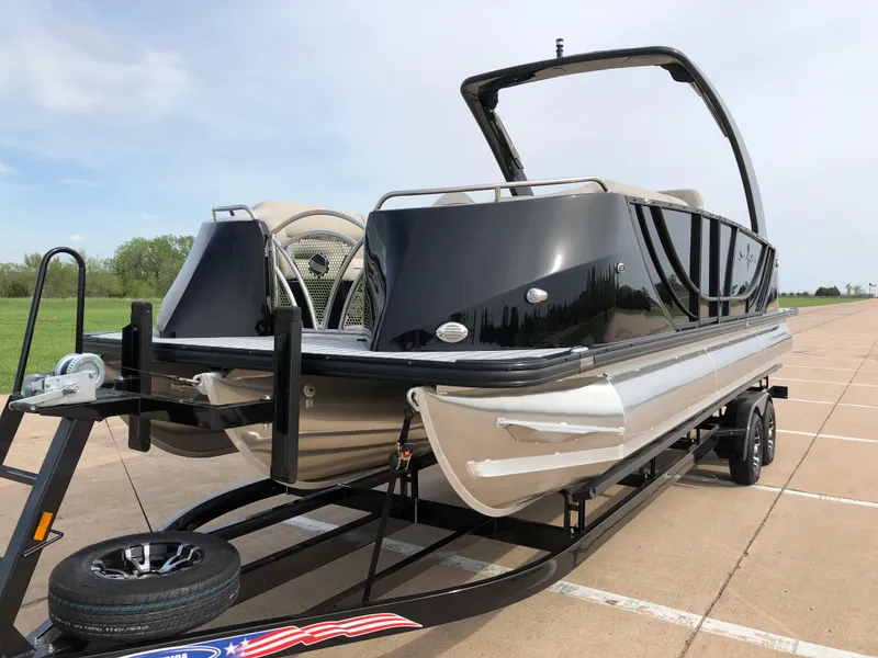 Slide: The Image of 2018 South Bay 25 Sport CR9 pontoon boat on trailer, parked outdoors. - 6