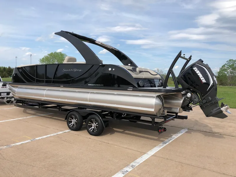 Slide: The Image of 2018 South Bay 25 Sport CR9 pontoon boat on trailer, parked outdoors. - 8