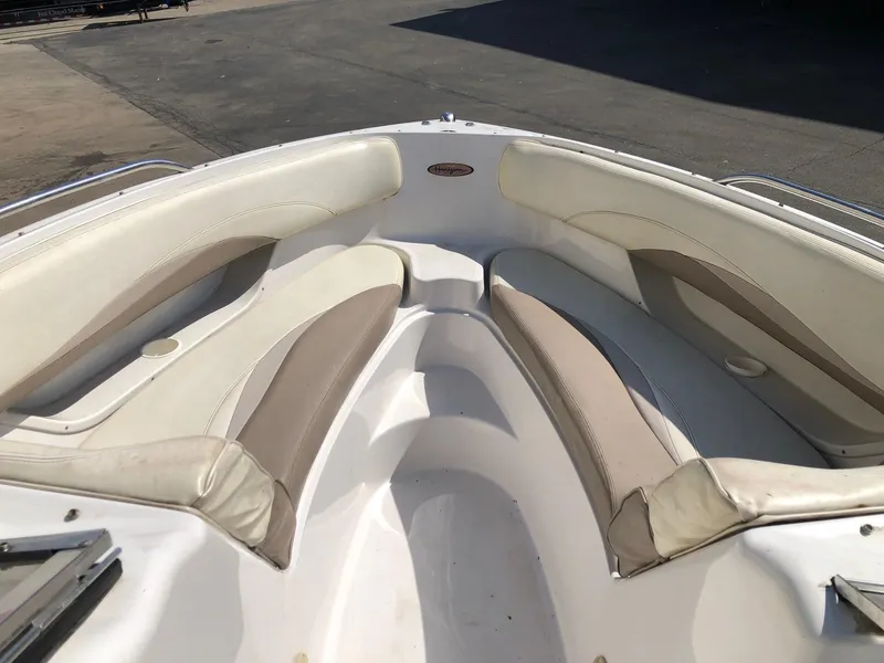 Slide: The Image of Interior view of 1997 Four Winns 240 Horizon boat with beige seating. - 6