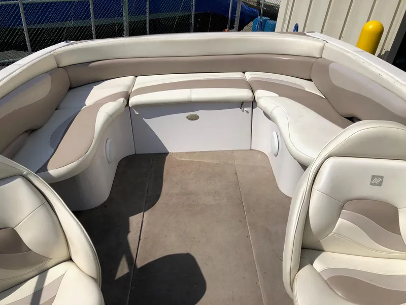 Slide: The Image of 1997 Four Winns 240 Horizon boat interior with beige and white seating. - 7