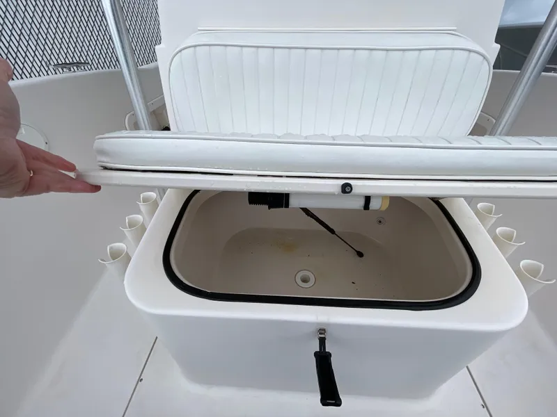 Slide: The Image of 1999 Grady-White 209 ESCAPE boat seat with storage compartment open. - 11
