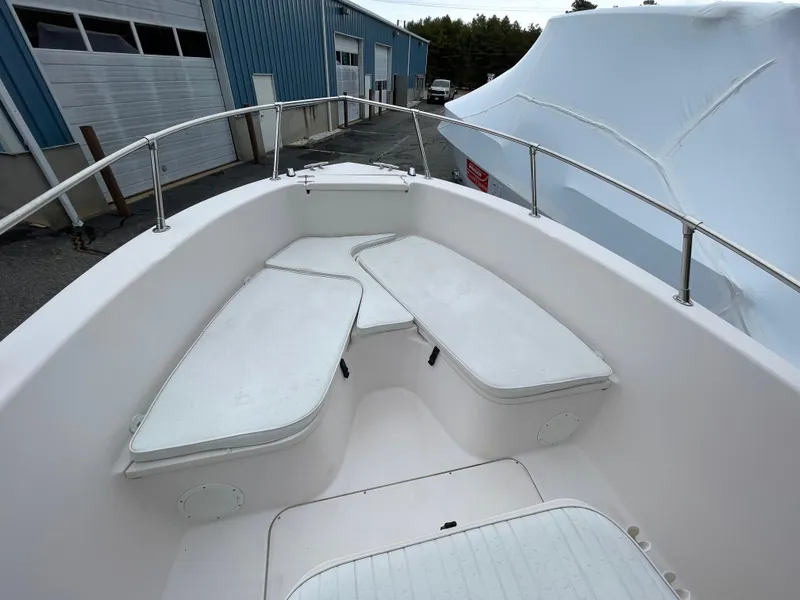 Slide: The Image of 1999 Grady-White 209 ESCAPE boat interior with white seating and railings. - 12
