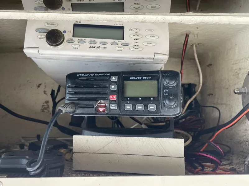 Slide: The Image of Radio equipment on a 1999 Grady-White 209 ESCAPE boat dashboard. - 4