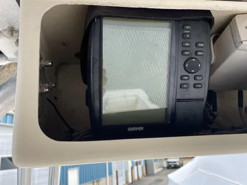 Slide: The Image of Garmin GPS device on 1999 Grady-White 209 ESCAPE boat dashboard. - 5