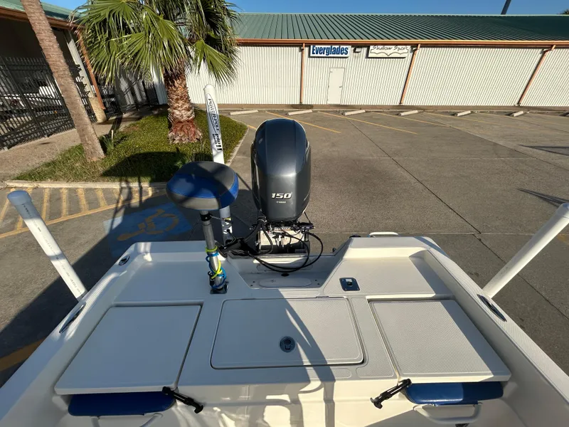 Slide: The Image of 2016 Skeeter SX 210 boat with 150 HP engine in a parking lot. - 7