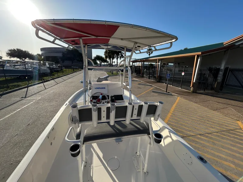 Slide: The Image of 2016 Skeeter SX 210 boat with T-top, docked under clear sky. - 8