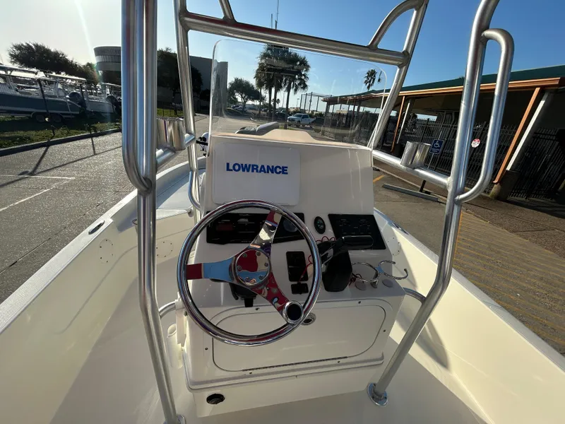 Slide: The Image of 2016 Skeeter SX 210 boat console with steering wheel and Lowrance navigation system. - 9