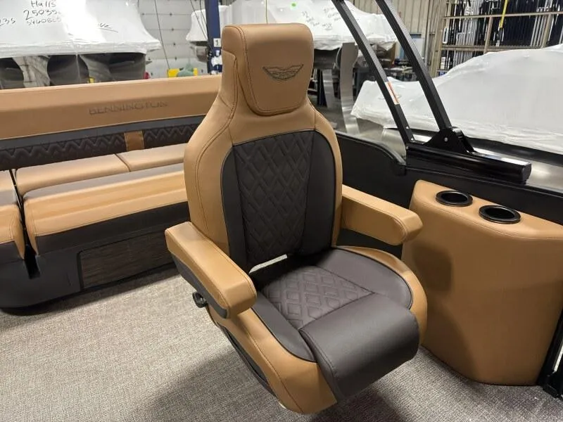 Slide: The Image of Luxurious seating in 2025 Bennington 22MSB-SPS boat, featuring tan and black upholstery. - 12
