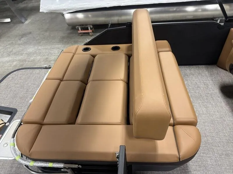 Slide: The Image of Luxurious tan seating on 2025 Bennington 22MSB-SPS boat, featuring cup holders and sleek design. - 8