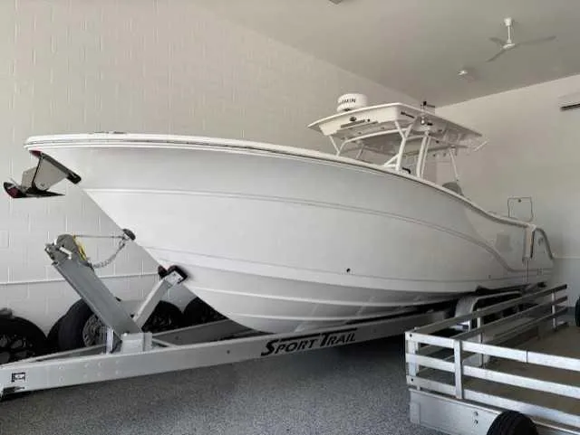 The Image of 2023 Sea Fox 328 Commander boat on trailer in garage. - 0