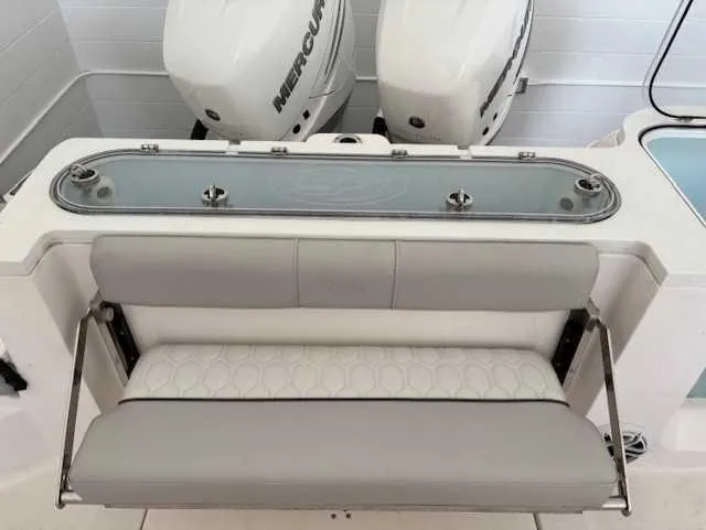 Slide: The Image of 2023 Sea Fox 328 Commander boat with dual Mercury engines and cushioned seating. - 10