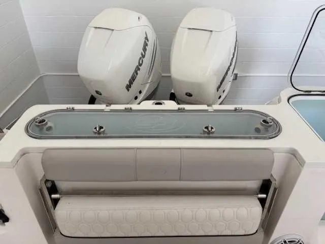 Slide: The Image of 2023 Sea Fox 328 Commander boat with dual Mercury engines and seating area. - 11